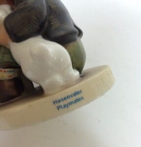 Figurine labeled "Hasenvater Playmates" with bunny.