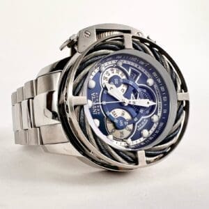 Silver watch with intricate blue dial.