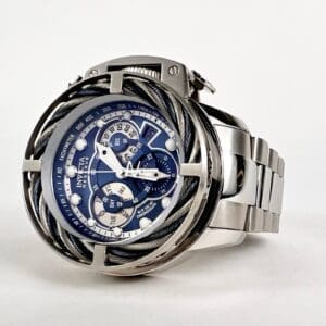 Silver watch with blue intricate dial design.