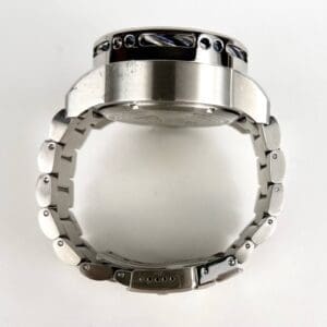 Silver wristwatch viewed from the side.