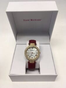 Watch with red strap in white box.