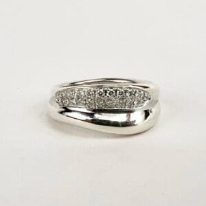 Silver ring with small embedded diamonds.
