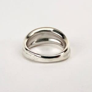Silver twisted band ring on display.