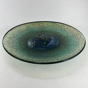 Ceramic bowl with green and blue glaze.