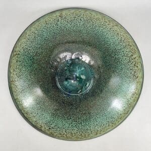 Green textured ceramic bowl, top view.