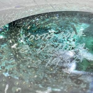 Abstract turquoise and white textured surface.