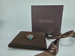 Ring with green gemstone and Le Vian box.
