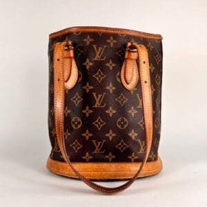 Brown designer handbag with monogram pattern.