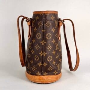 Luxury monogram leather bucket bag with straps.