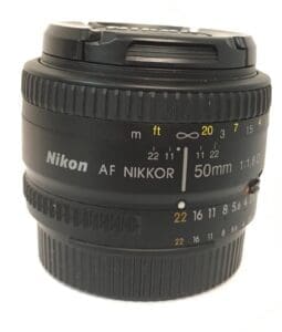 Nikon 50mm camera lens with focus markings.