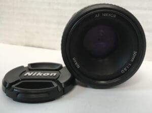 Nikon camera lens and lens cap.