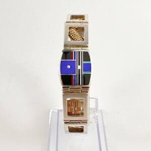 Geometric wristwatch with colorful abstract design.
