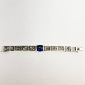 Silver bracelet with engraved rectangular links.