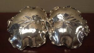 Silver leaf-shaped decorative serving dishes.