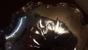 Silver bowl with engraved model number.
