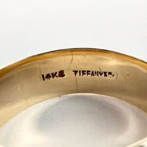 14K Tiffany gold ring inscription close-up.