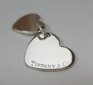 Heart-shaped Tiffany & Co. silver charm.