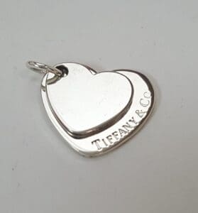 Heart-shaped Tiffany & Co. silver pendant.
