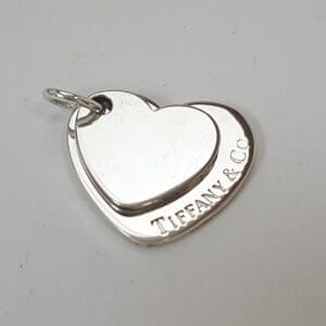 Heart-shaped Tiffany & Co. silver pendant.