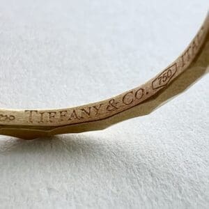 Tiffany & Co. gold bracelet close-up.