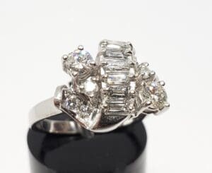Silver ring with multiple sparkling gemstones.