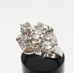 Silver ring with multiple sparkling diamonds.