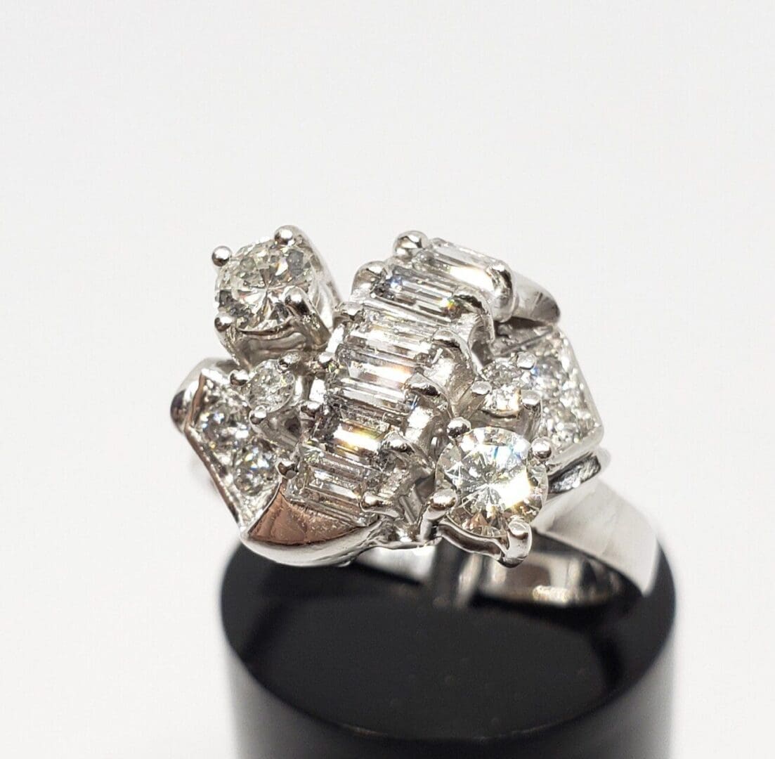 Silver ring with multiple sparkling diamonds.