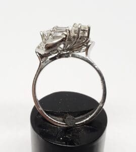 Silver ring with intricate gemstone setting.