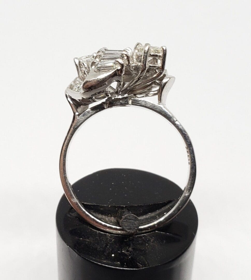 Silver ring with intricate gemstone setting.