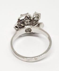 Silver ring with intricate floral design.