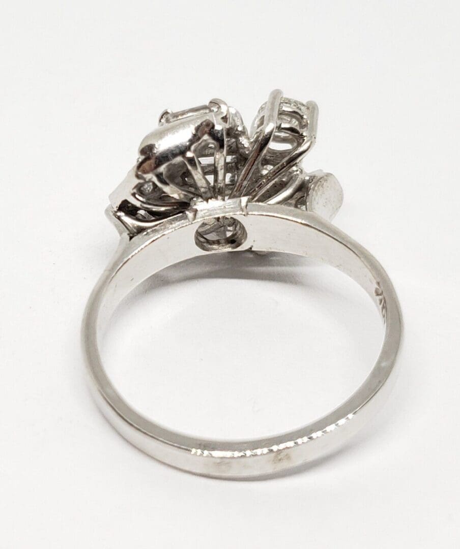 Silver ring with intricate floral design.