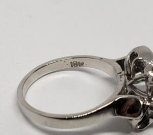 Silver ring with "18k" engraving.