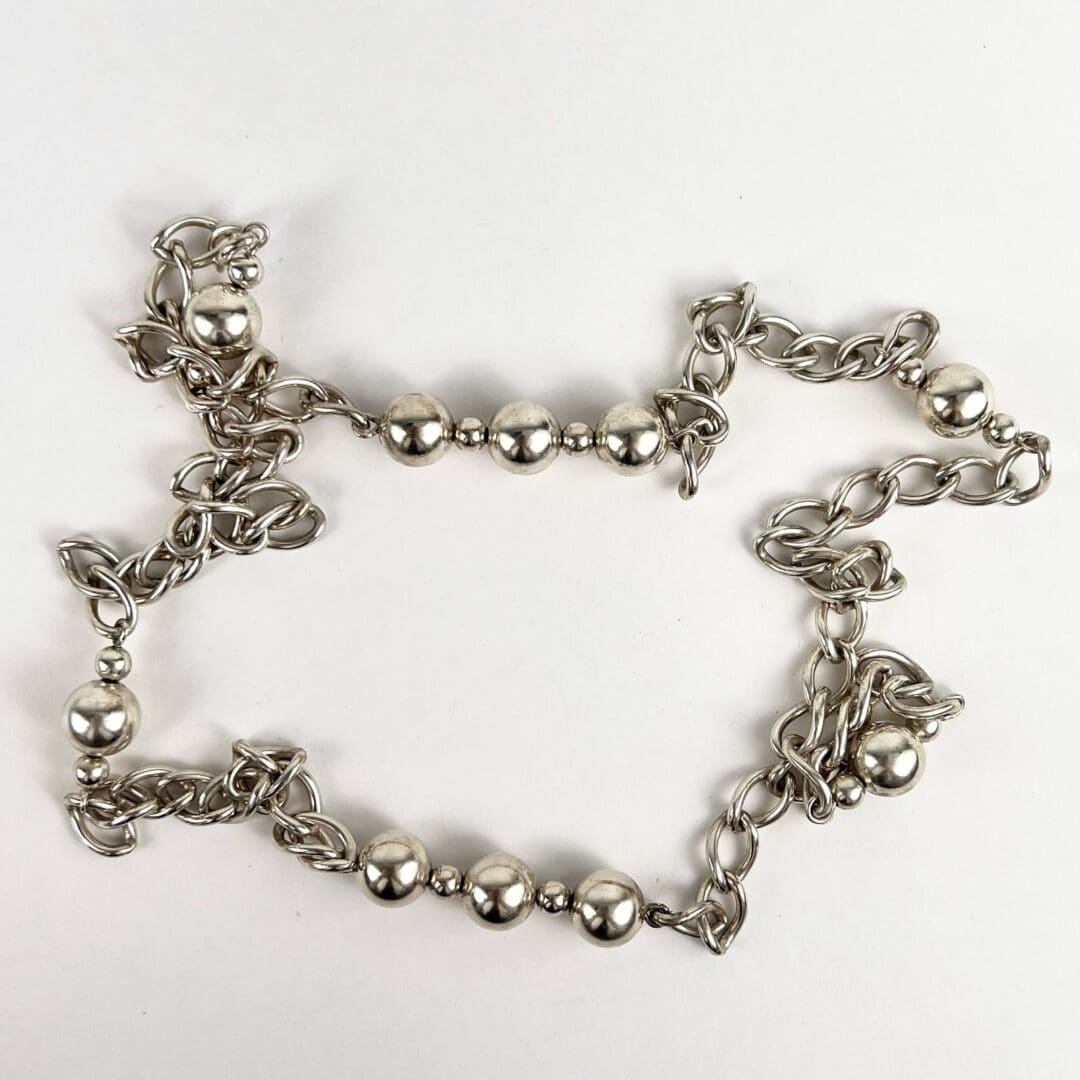 Silver chain with spherical beads arrangement.