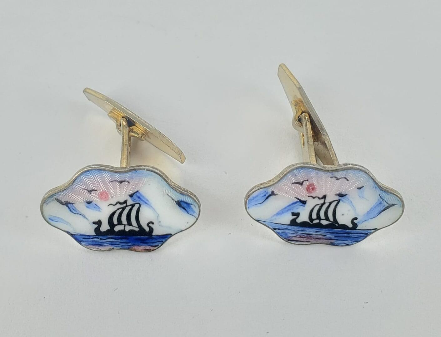 Viking ship cufflinks with colorful enamel.