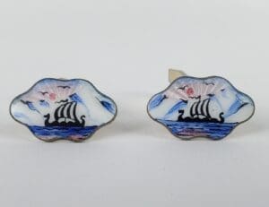 Viking ship cufflinks with enamel design.