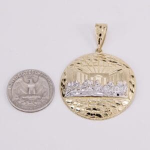 Gold pendant with Last Supper design, coin.