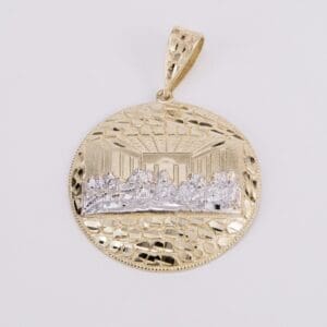 Gold pendant depicting the Last Supper scene.