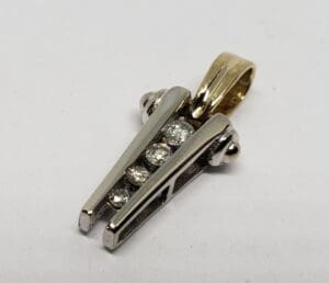Gold and silver pendant with diamonds.
