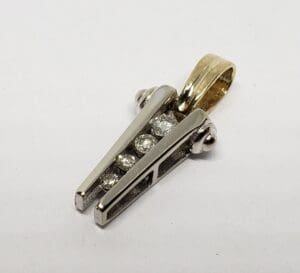 Gold and silver pendant with diamonds.
