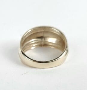 Gold ring on white background.