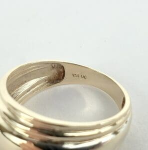 Gold ring with an interior inscription.