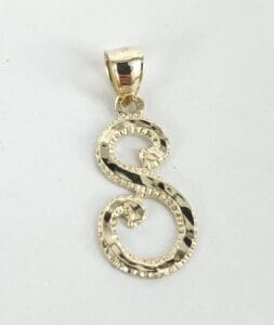 Gold ornate letter "S" pendant.