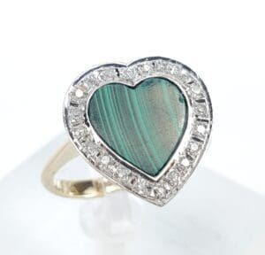 Heart-shaped malachite ring with diamond accents.