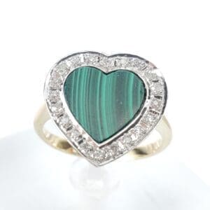 Heart-shaped malachite ring with diamond accents.