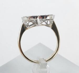 Gold ring with intricate silver setting.