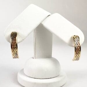 Gold and silver hoop earrings display.