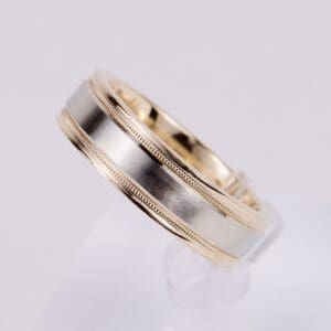 Gold and silver wedding band ring.