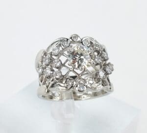 Ornate diamond ring with intricate lattice design.