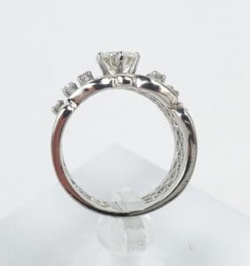 Diamond ring with decorative side stones.