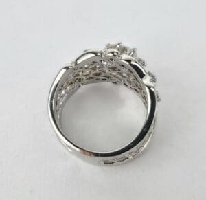 Silver ring with intricate lattice design.